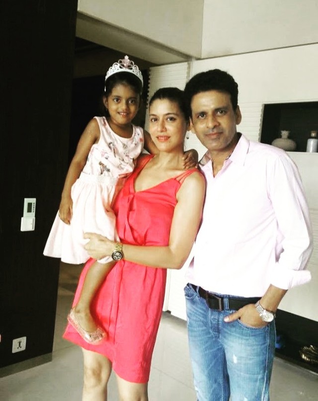 Ava Nayla as a small child held by her mother Neha, with her father Manoj Bajpayee, at home.